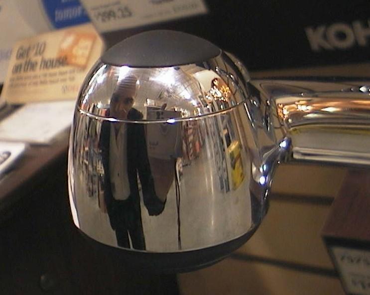 my self portrait in a shiny faucet