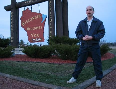 Brett at the Wisconsin Welcomes You sign